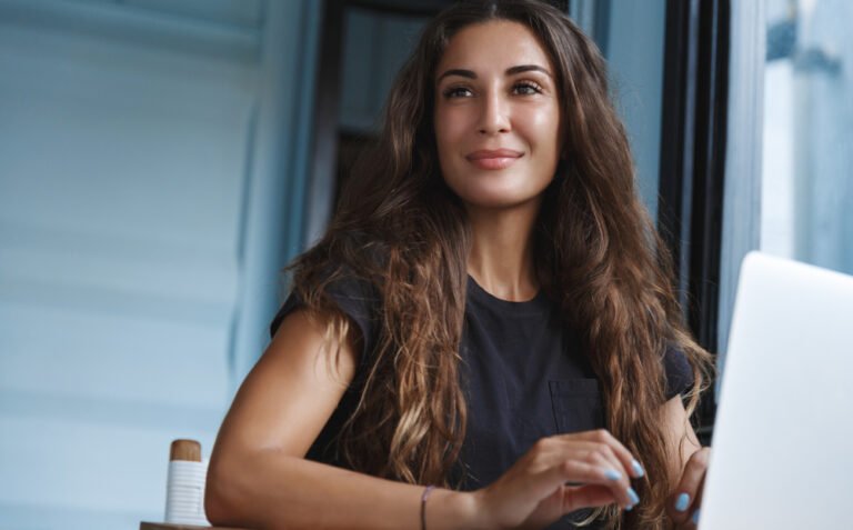 Smiling,Businesswoman,Working,From,Home,,Sitting,In,Room,And,Using